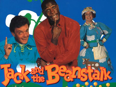 Boxer Frank Bruno on a poster for Jack and the Beanstalk with blue background and the title in orange.